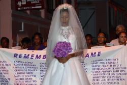 In the 2012 Take Back the Night event on St. Croix, Reshauna Christopher marches in a wedding dress to honor wives who suffer domestic violence. In the 2012 Take Back the Night event on St. Croix, Reshauna Christopher marches in a wedding dress to honor wives who suffer domestic violence.